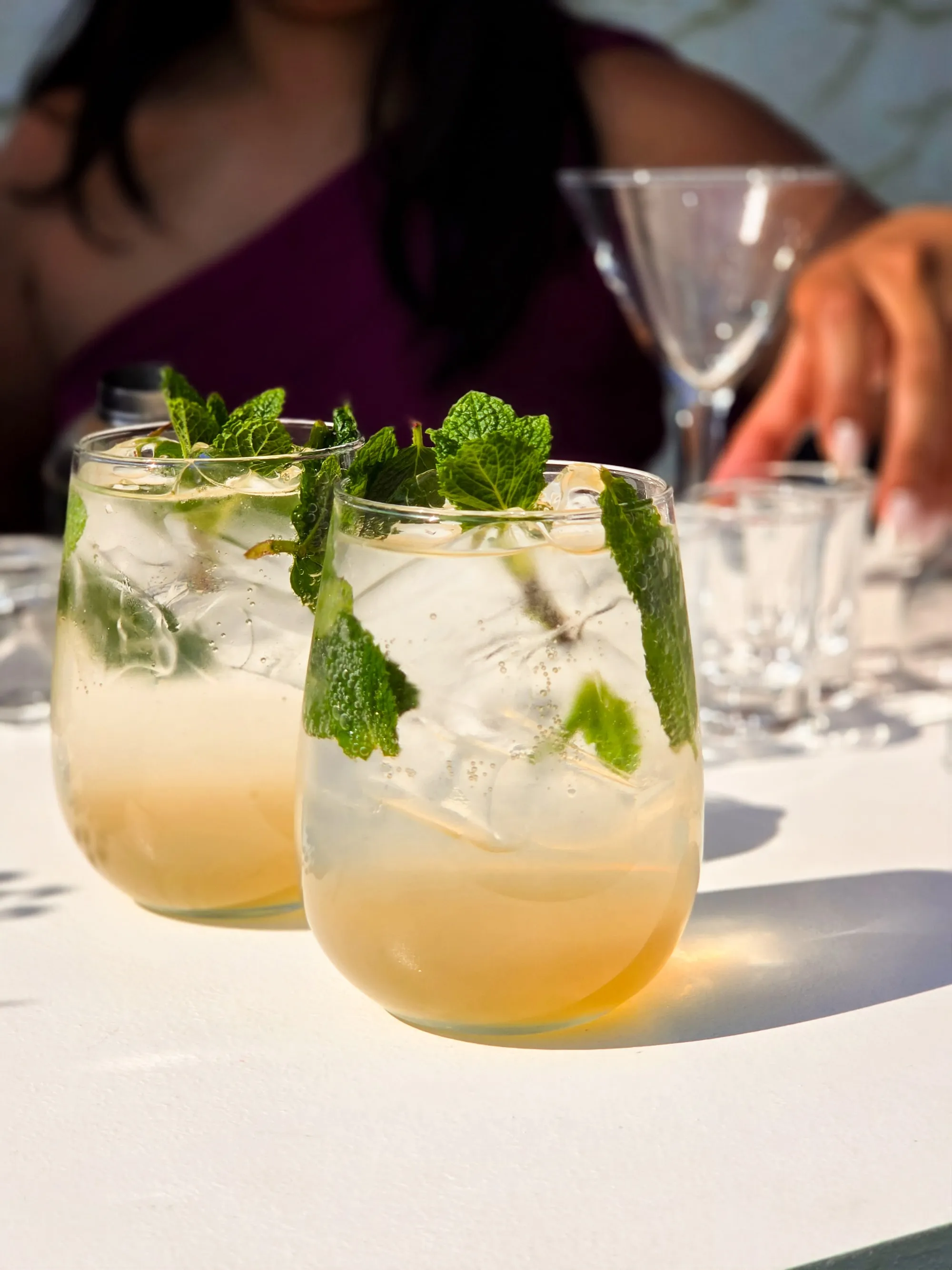 Two cocktails with fresh mint and ice served at the KaizenCo launch